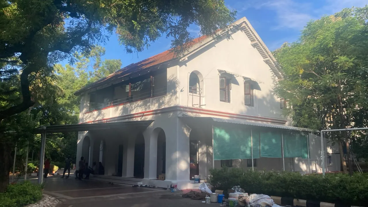 Heritage-style colonnaded building painted off-white