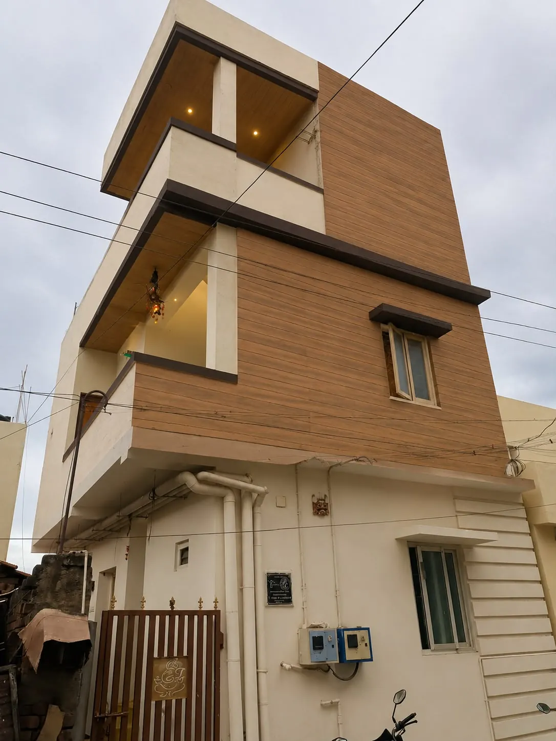 Contemporary stacked residence with wood-tone upper cladding