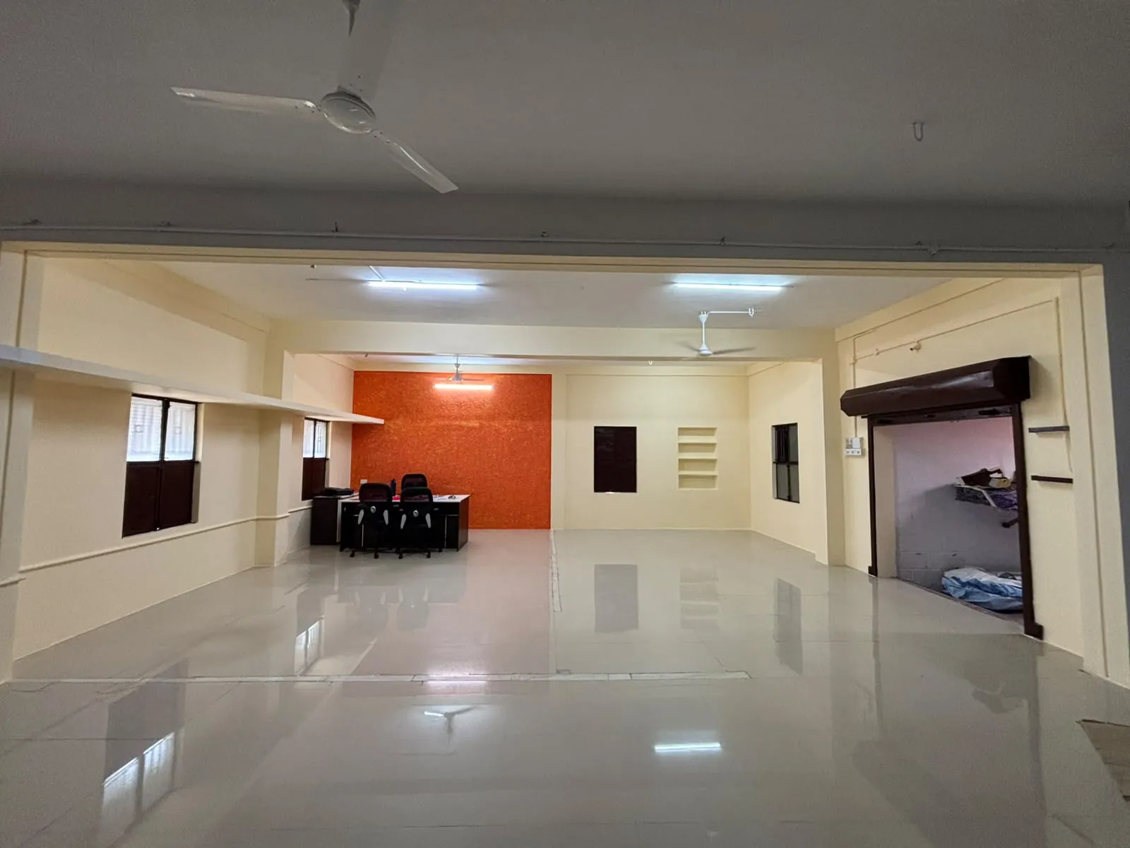 Interior space with white walls and an orange accent feature wall