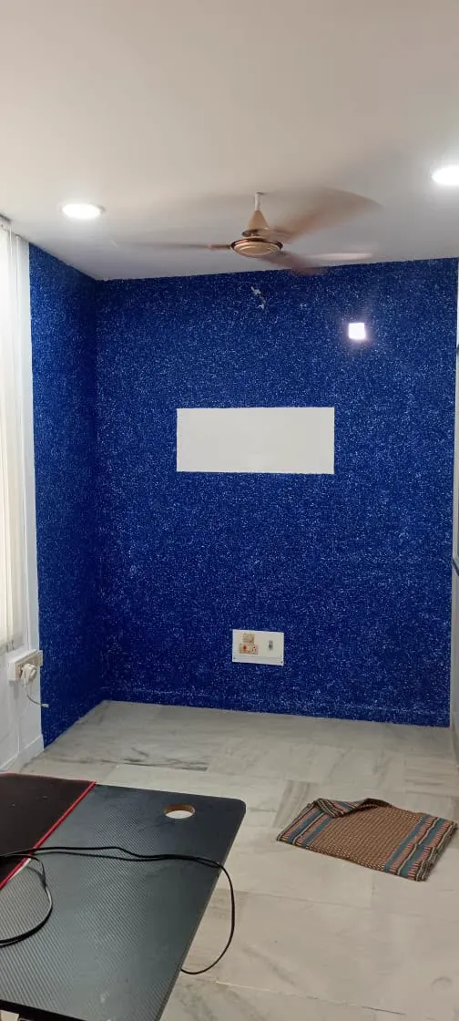 Interior feature wall with deep blue speckled texture finish